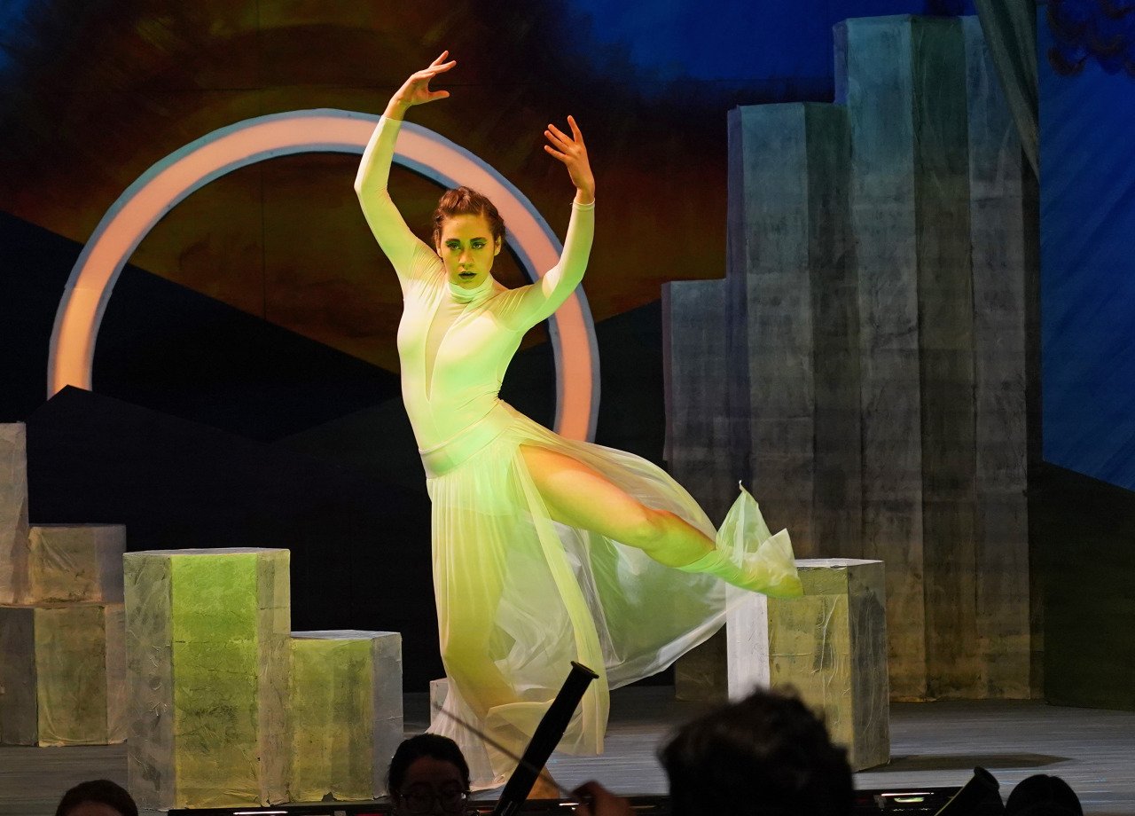  Act I: Dancer Laura Coe ’22 portrays a fearsome serpent bent on killing the prince Tamino.  Photo credit Finn Bamber ’22. 