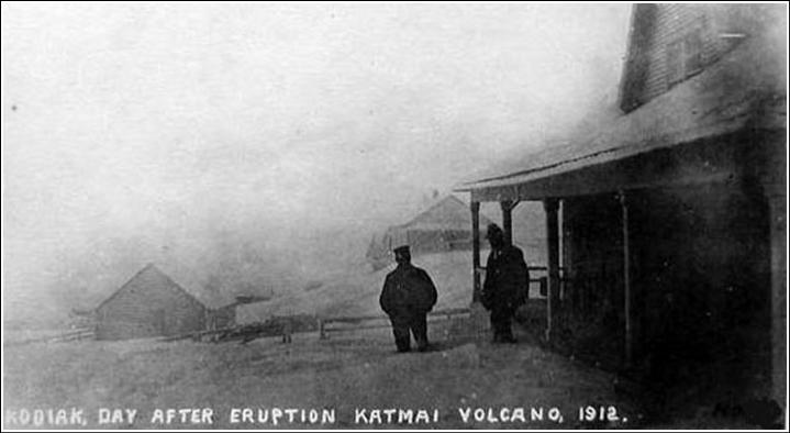This is ash, not snow. W.J. Erskine could be the man to the right, or he was the photographer. The men are standing in front of Erskine's house, which is today the Baranov Museum in Kodiak. Image courtesy USGS. 