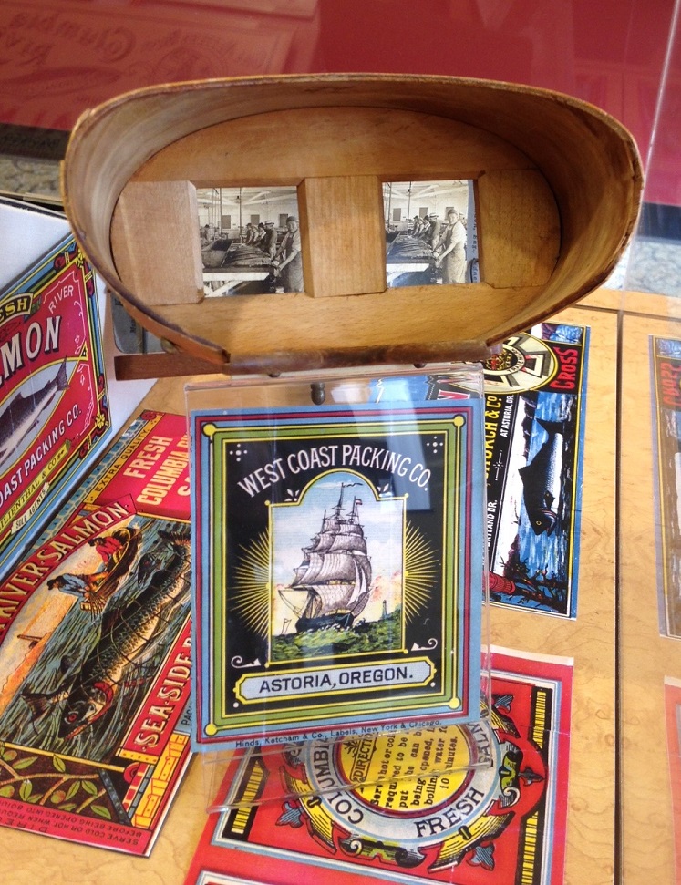 Cannery ephemera and a stereoscopic view of the inside of an Astoria cannery, all on display within a bank in Astoria. 