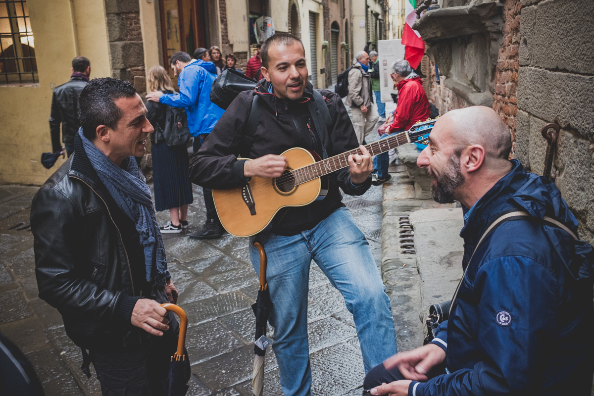 Good spirits in the streets of Lucca despite the rain
