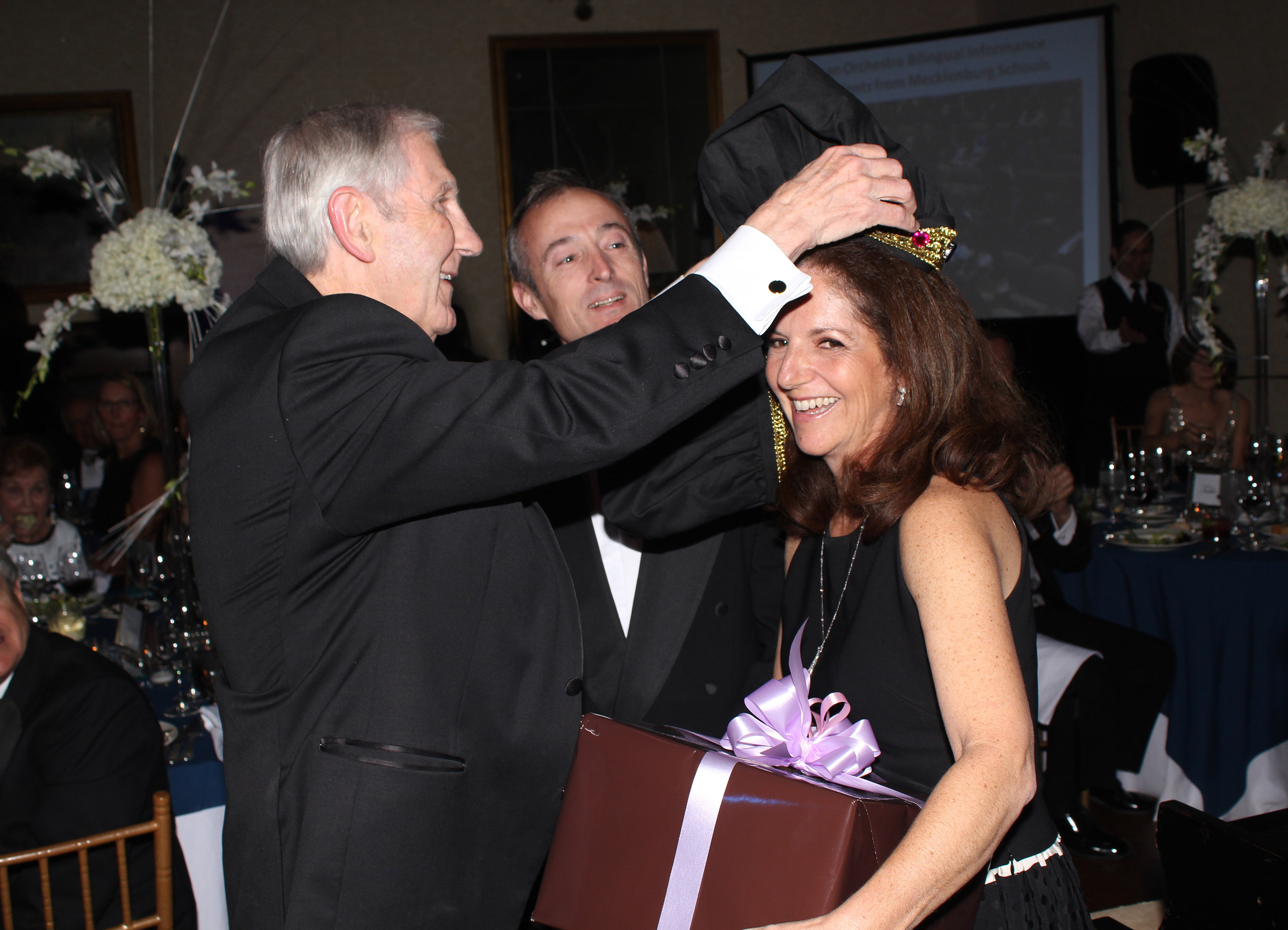 Gene Hoots crowns Bruce and Leslie Schlernitzauer as the king and queen of the ball.&nbsp;