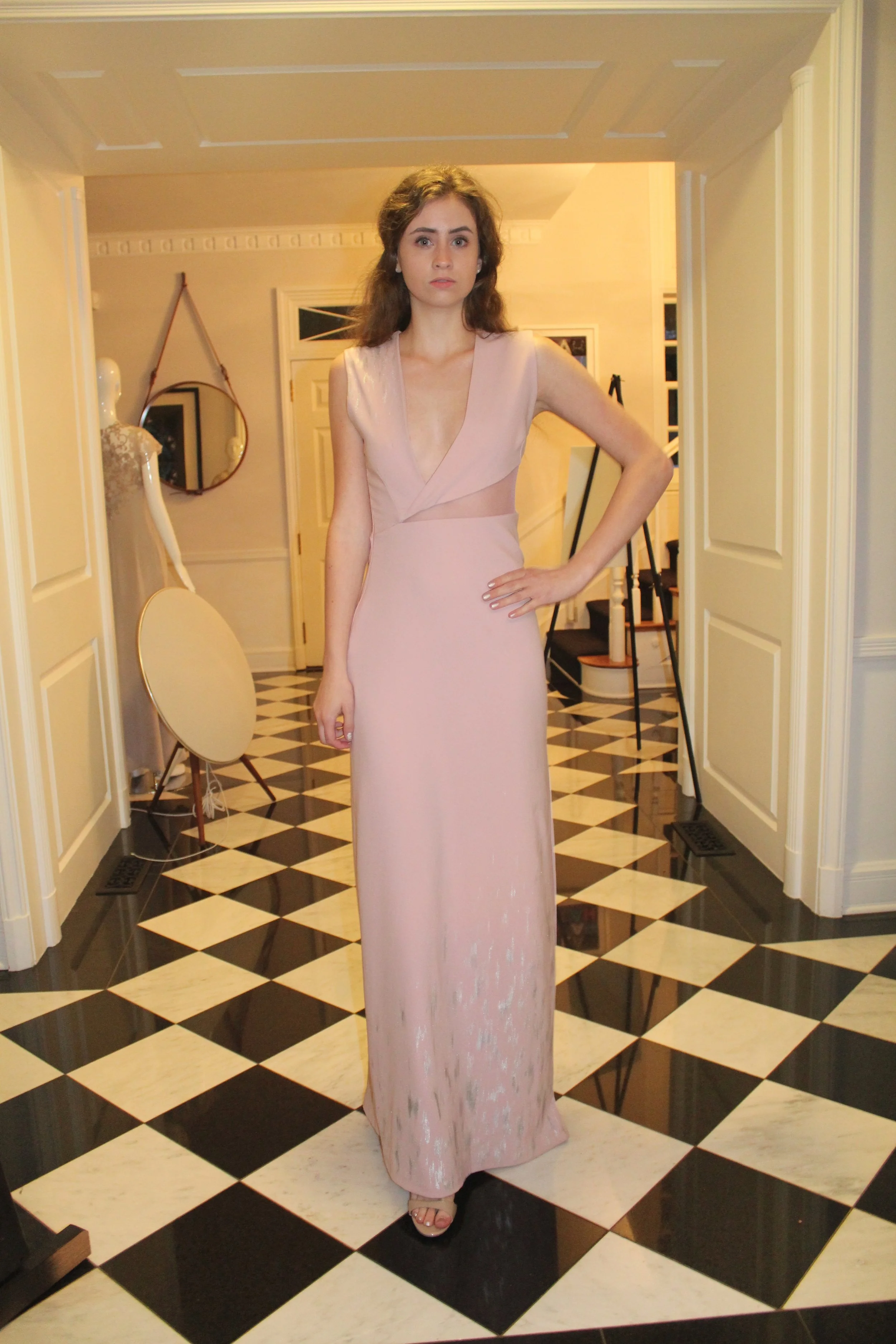 A model wears a hand-painted Victoria Cullinan gown inspired by the Japanese art form of kintsugi during the brand's launch party. 