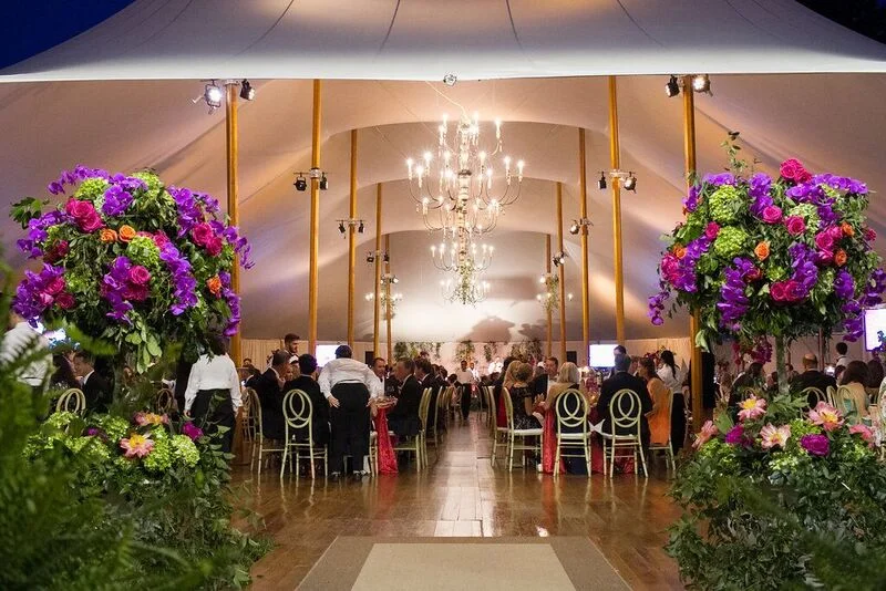Two enormous and gorgeous floral displays from Watered Garden Florist at the tent's entrance. 