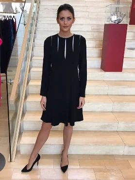 This little black dress from Tom & Linda Platt is perfect for women who want to look elegant and modern without revealing too much skin. It's available at Paul Simon Women. 