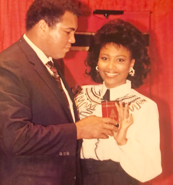 Francene in a fragrance ad with famous boxer Muhammad Ali.
