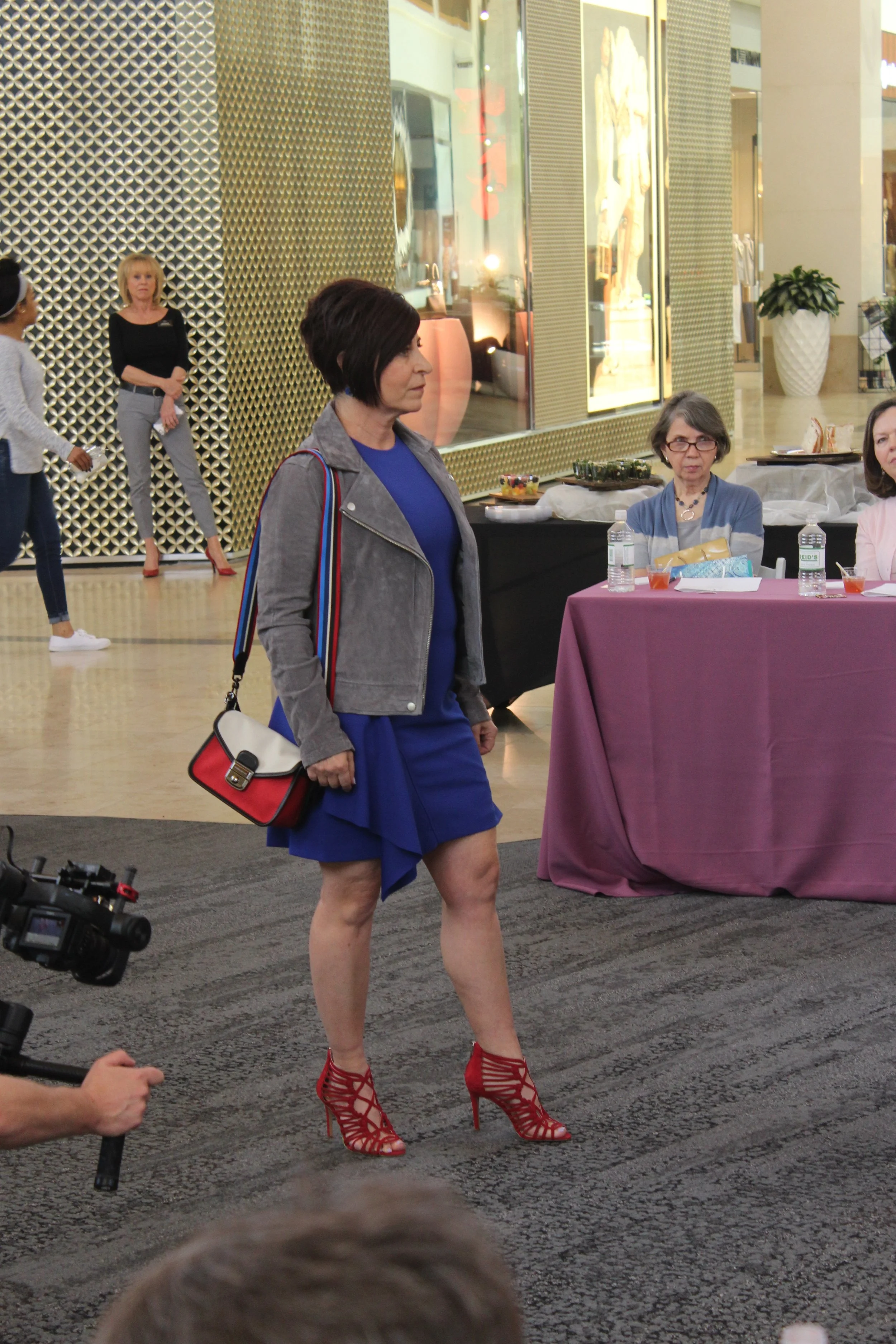 Darla's outfit, including Vince Camuto heels and a two-tone Longchamp bag, were from Nordstrom.