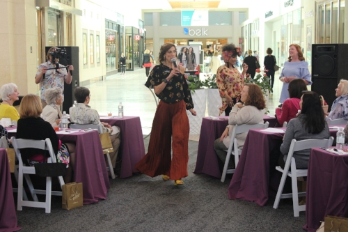 Suzanne looked amazing in her Elizabeth &amp; James bronze pleated palazzo pants from Nordstrom paired with an A.L.C. top and Halogen shoes.