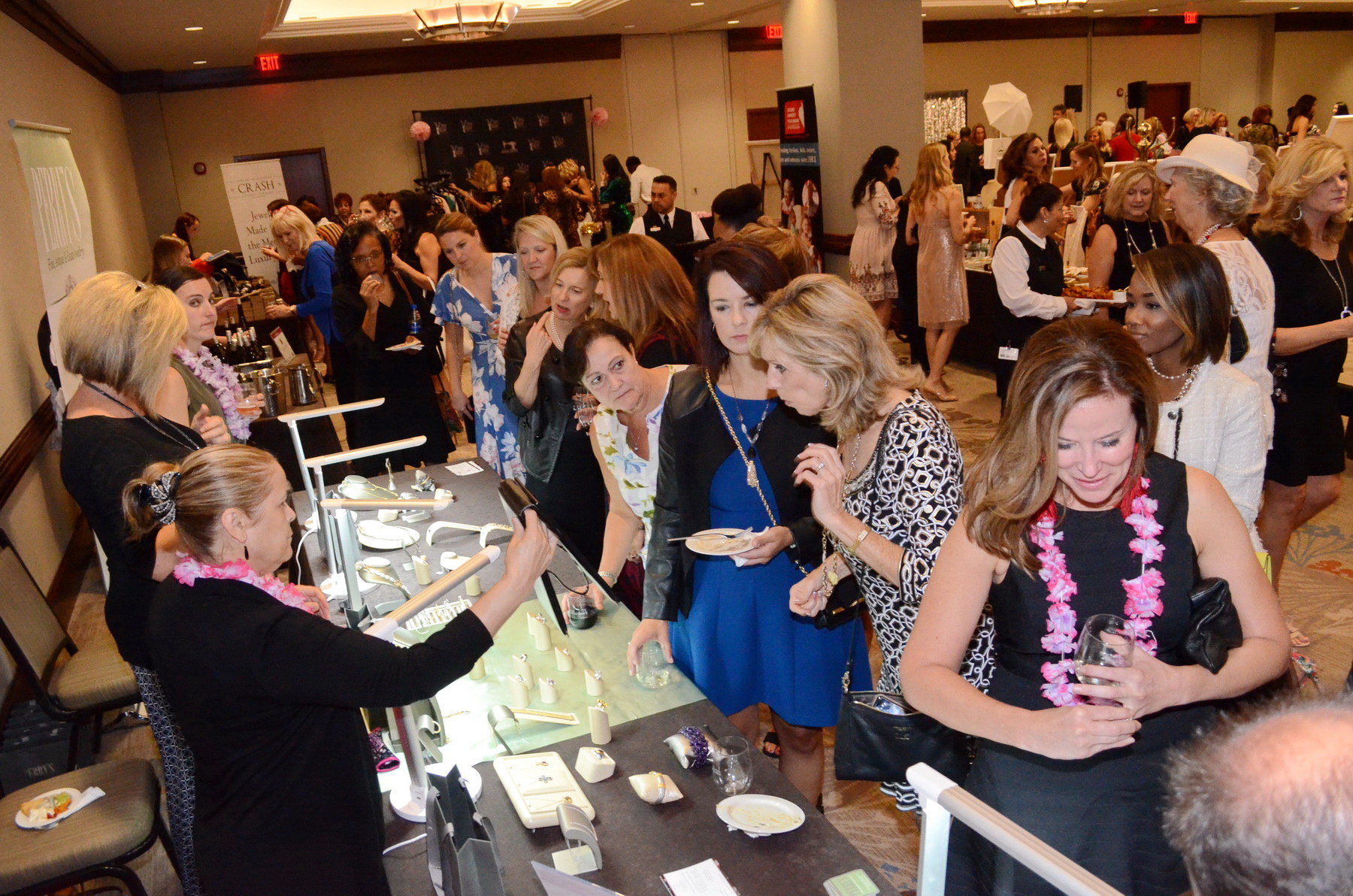  Guests shop at the Perry’s Diamonds &amp; Estate Jewelry booth. 