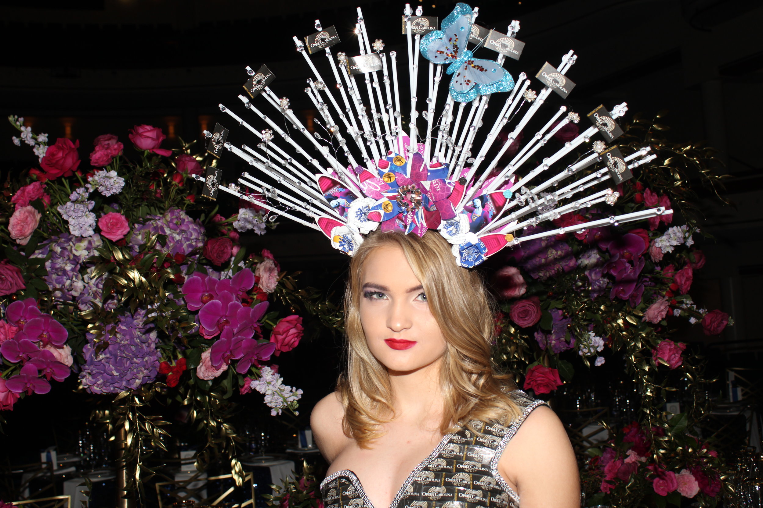  A model shows off a fantastical design made from recycled opera programs during the cocktail hour.  