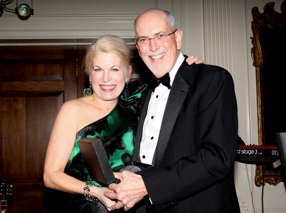  Pat Farmer presents an award to Ernest Perry, Owner and President of Perry's Diamonds and Estate Jewelry. 