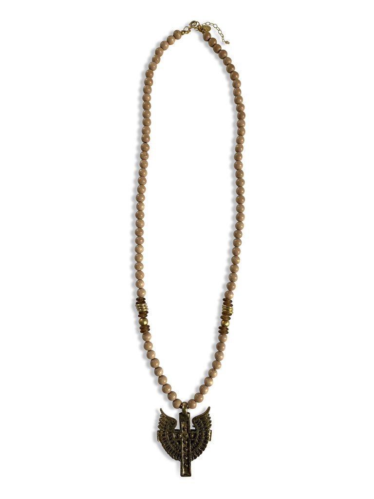   KAREN NECKLACE: A large cross necklace with wings created by Karen, a formerly homeless graduate of the nonprofit Fashion &amp; Compassion who now has a home and an MBA. $78. Fashion &amp; Compassion, 1717 Cleveland Ave., or at    fashionandcompass