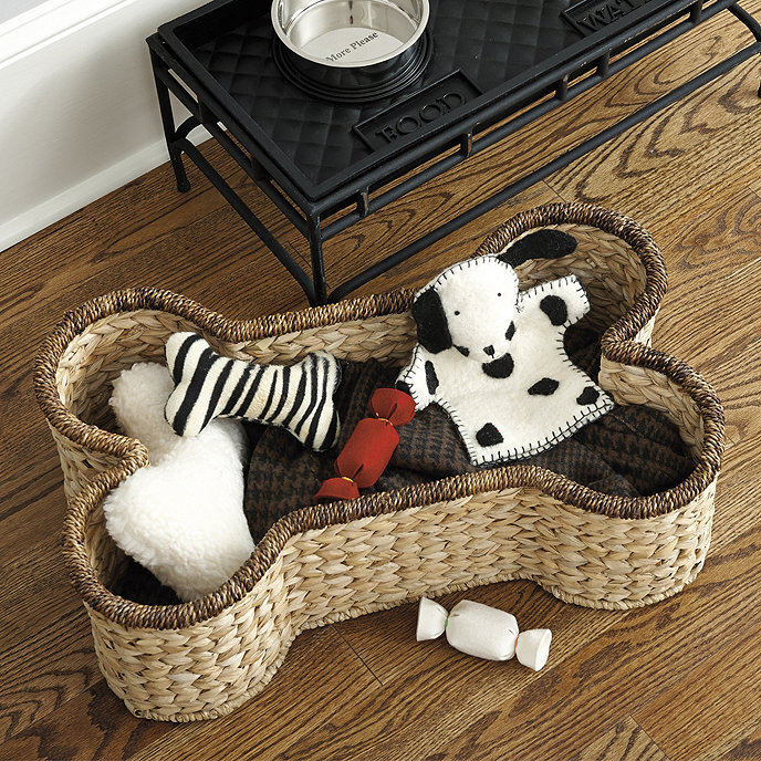   SPOT DOG BONE BASKET: Keep toys tidy with this earth-friendly basket made of natural materials. $79. ballarddesigns.com.  