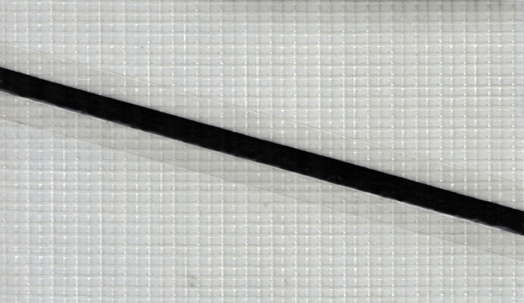 A single carbon tape on PM05T, the most commonly used polyester laminate for Tape-Drive sails.