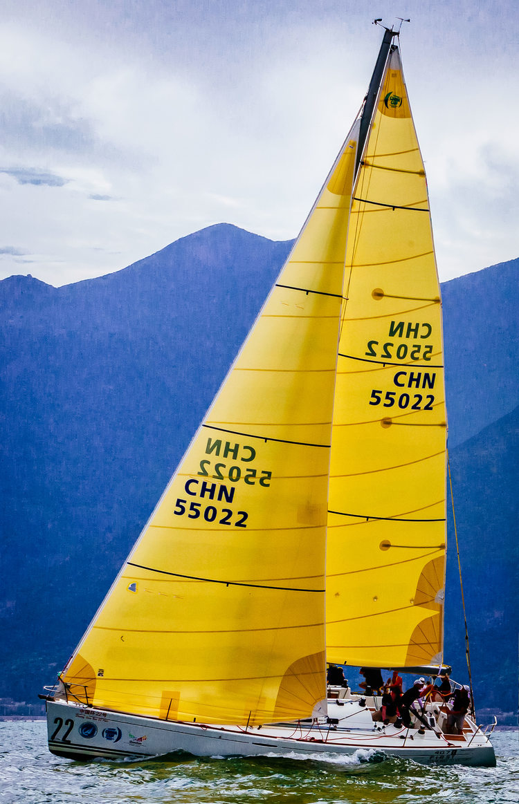 A Beneteau 40.7 with yellow aramid Flex main and genoa.