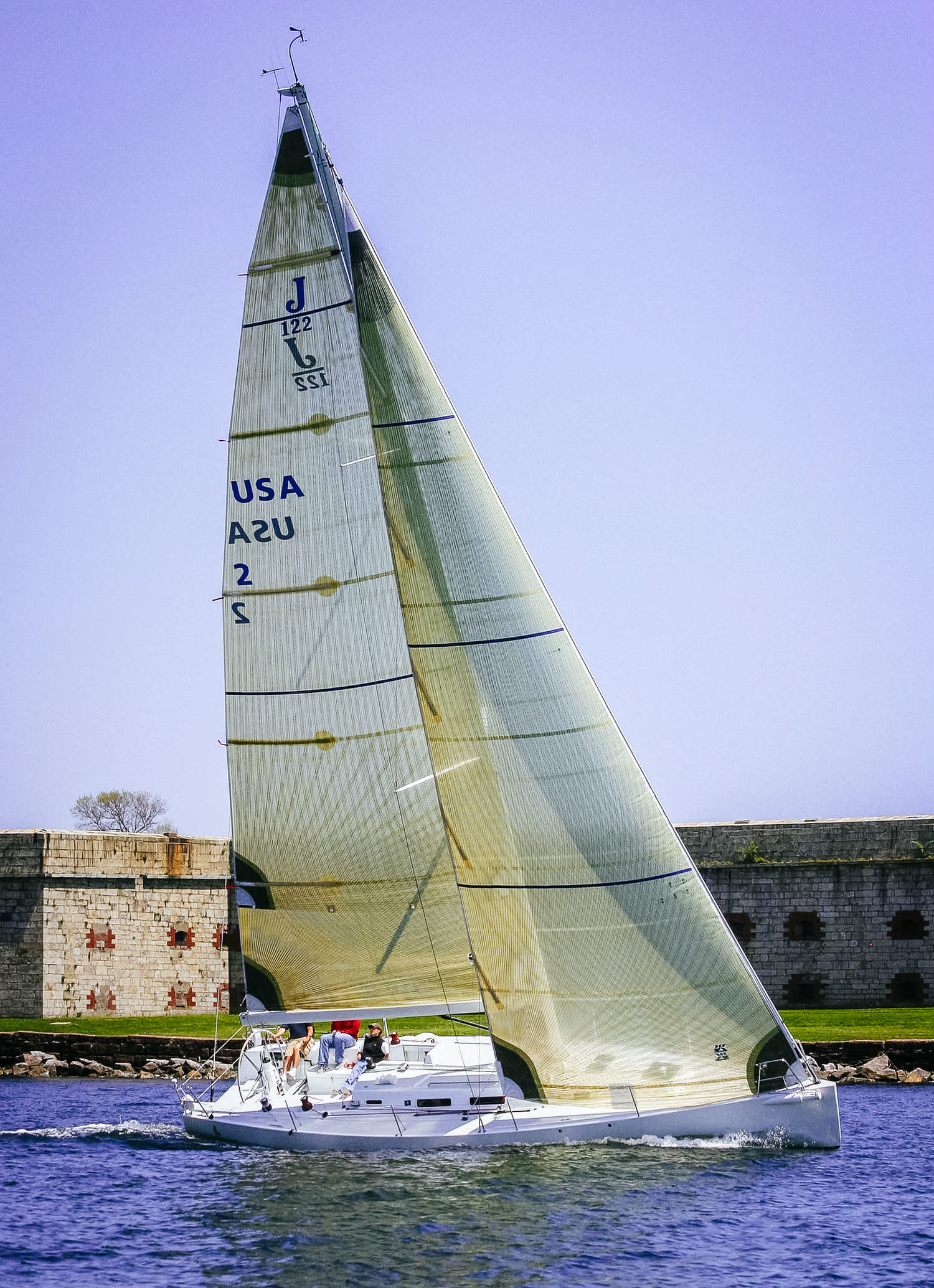 With wide swept-back spreaders, the jibs can overlap the mast slightly as shown above on this J/122.