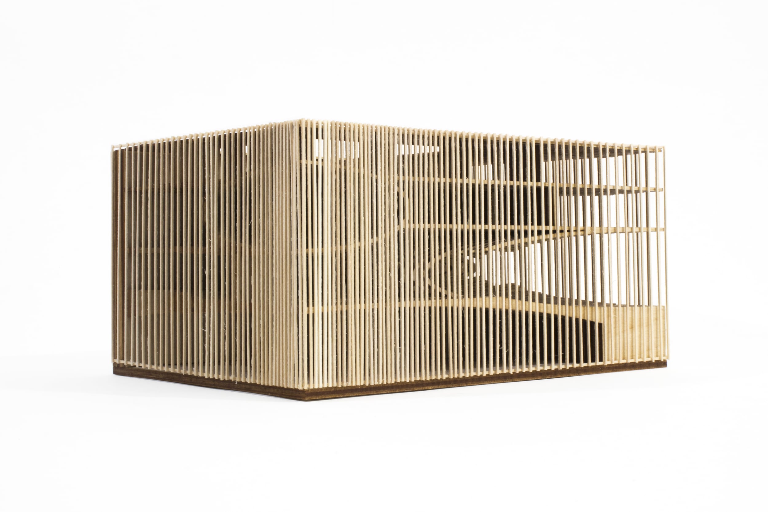 Contextual model at 1/16" = 1'. Interior structure is modeled with laminated basswood. Exterior louvers are hand-cut basswood sticks.