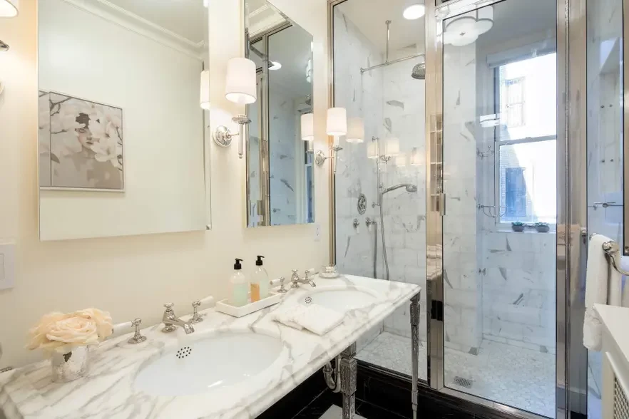 NYC-Sutton-Place-Classical-Gut-Renovation-Primary-Bathroom-Custom-Marble-Tile-Shower-Stonework-Sink.webp