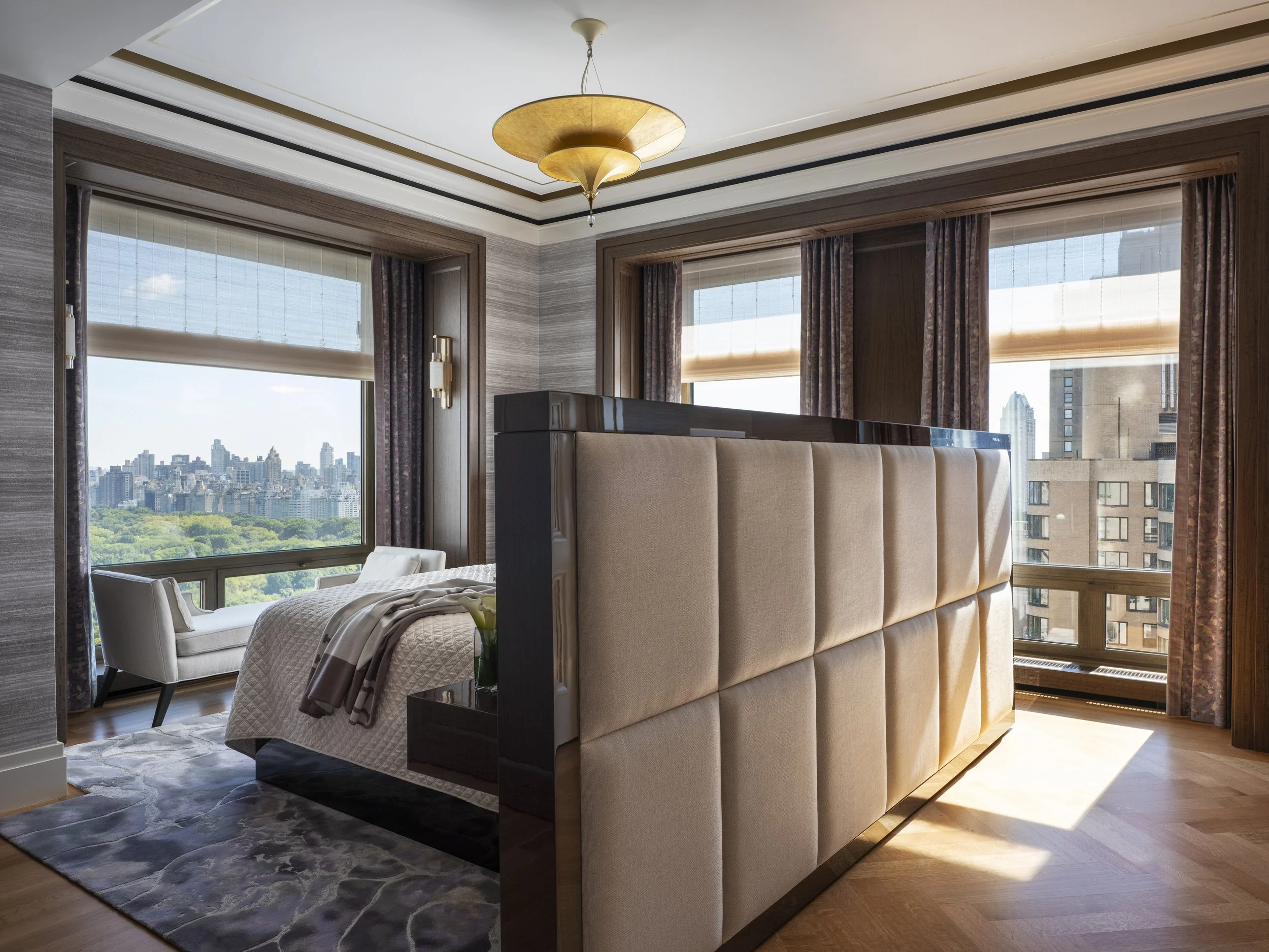 NYC-220-Central-Park-South-Primary-Bedroom-Phillip-Jeffries-Wallpaper-Gold-Leaf-Crown-Moulding-Custom-Bed-With-Integrated-Television-Lift.jpg