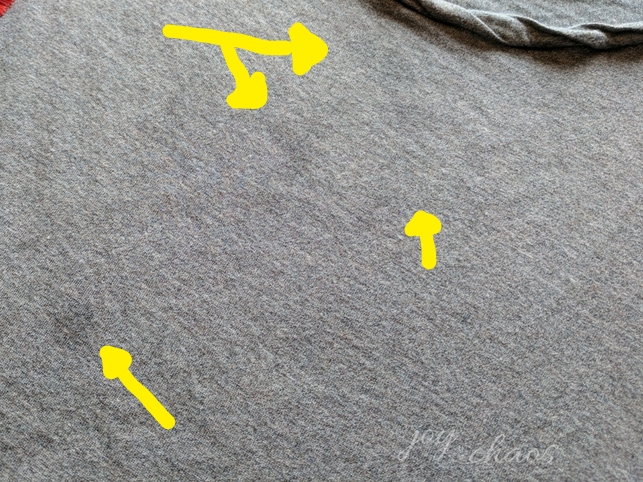 grey shirt with grease stains