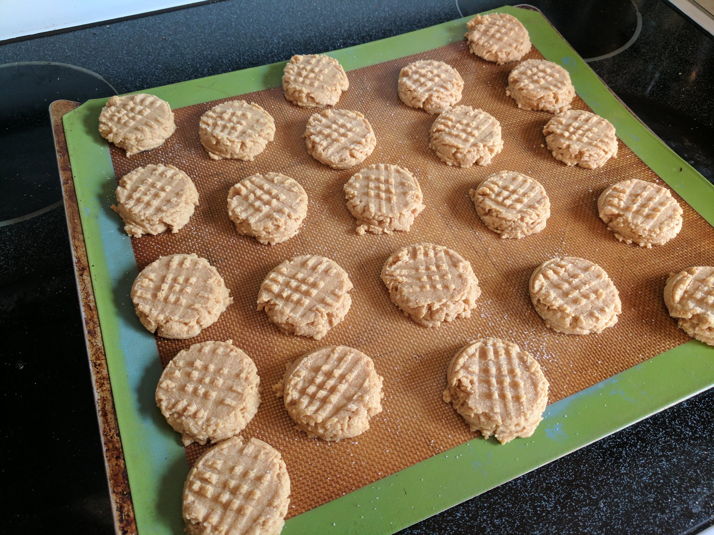  3 ingredient peanut butter cookies on baking mat 