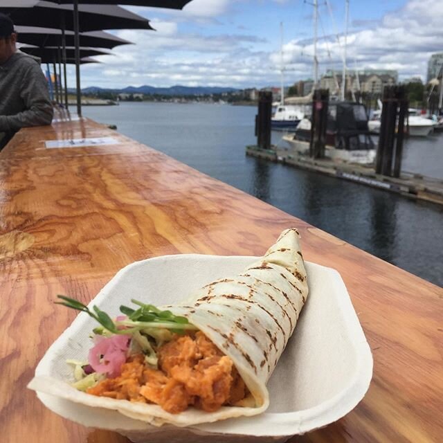 Feature today: Thai Red Curry Tacone - halibut and salmon in a coconut red curry sauce, with pickled onions, slaw, cilantro shallot aioli! And, we have some seating back on the pier! Order online or in person. #yyjfood #seafoodbythesea #fishtacos