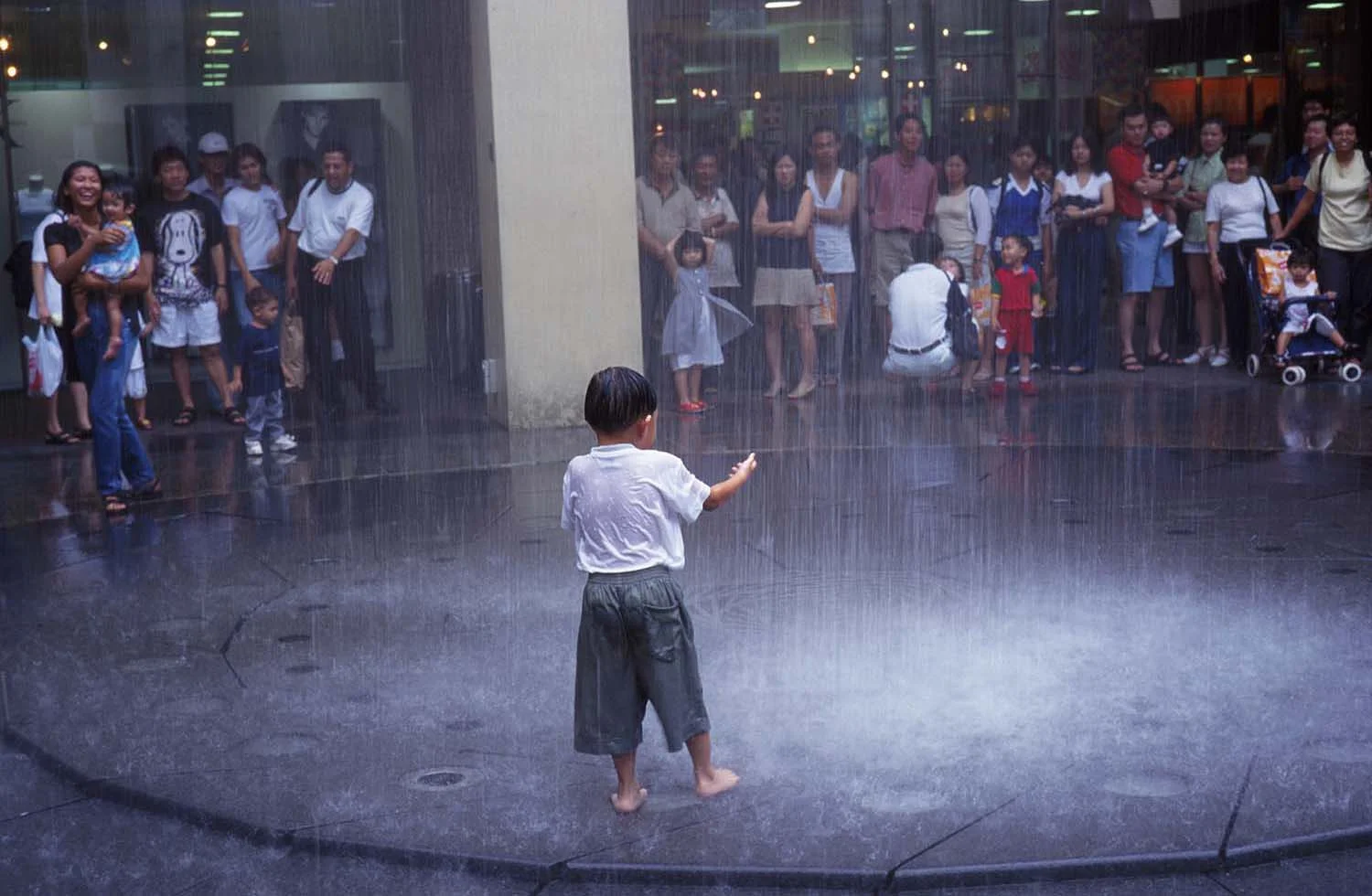 Child play in the fountain, Singapore