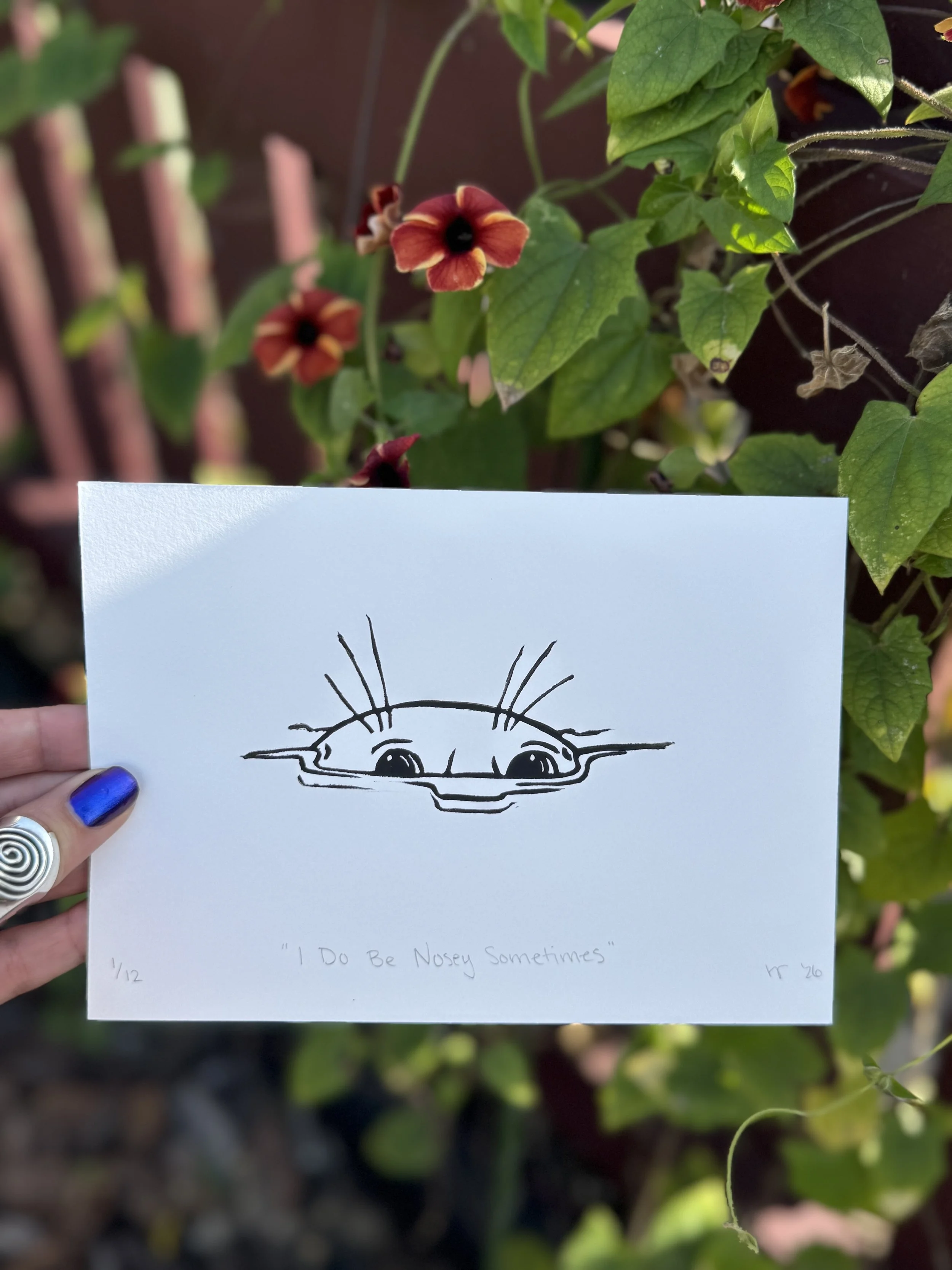 Black and white linoprint of a nosey seal poking its head out of the water
