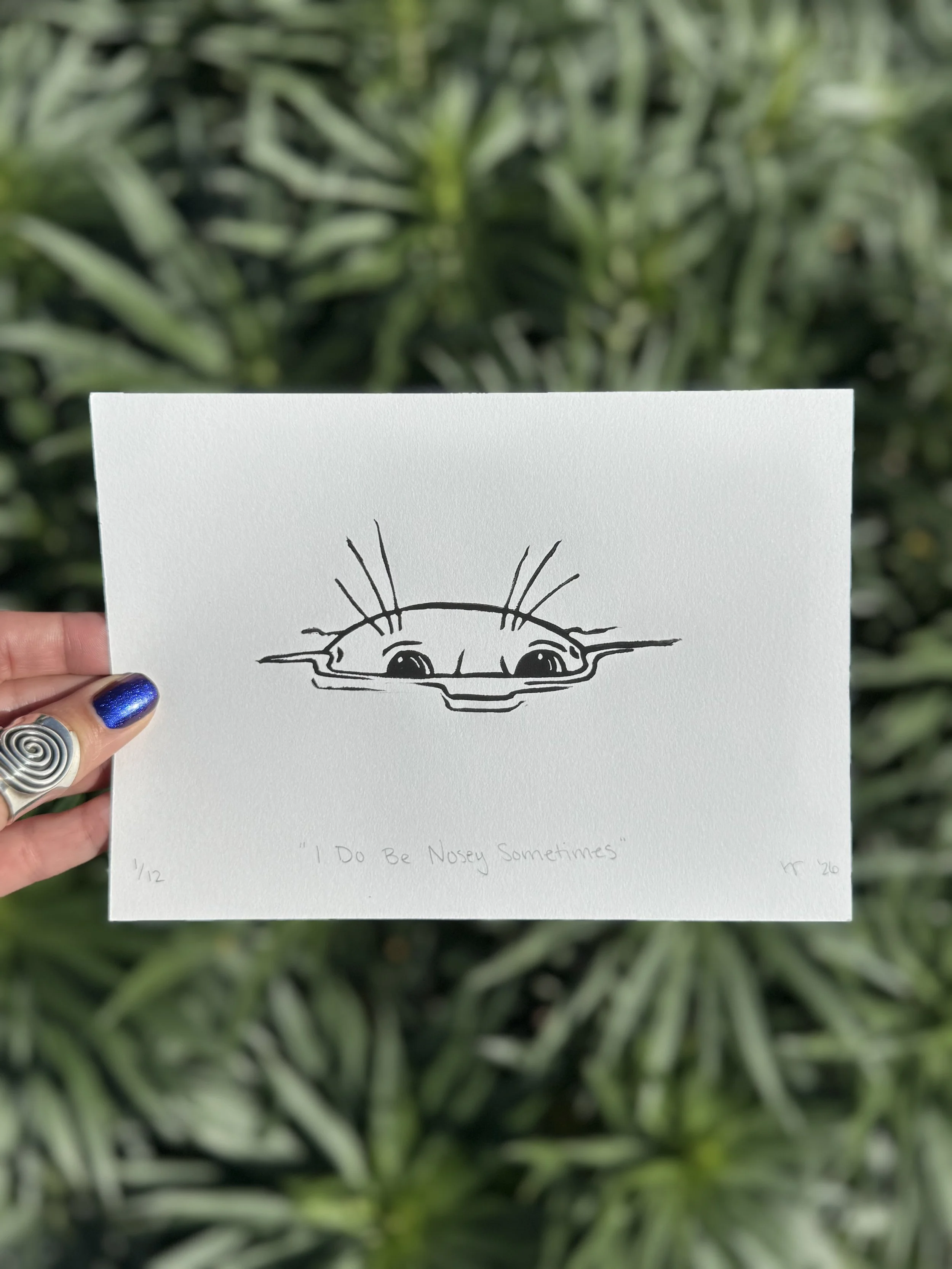 Black and white linoprint of a nosey seal poking its head out of the water