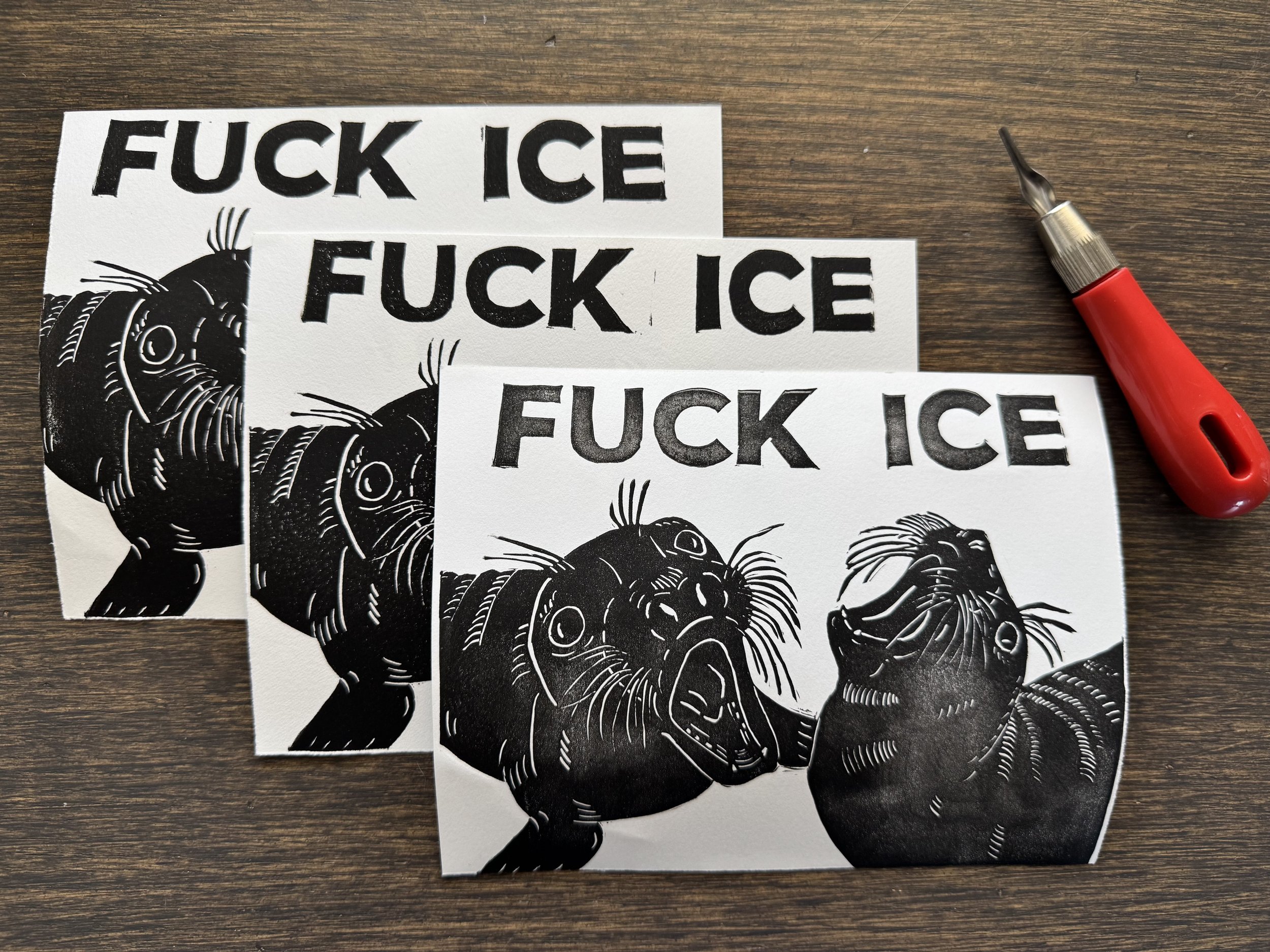 A stack of 3 black and white linoprints of two elephant seal pups throwing their heads back and screaming "FUCK ICE"