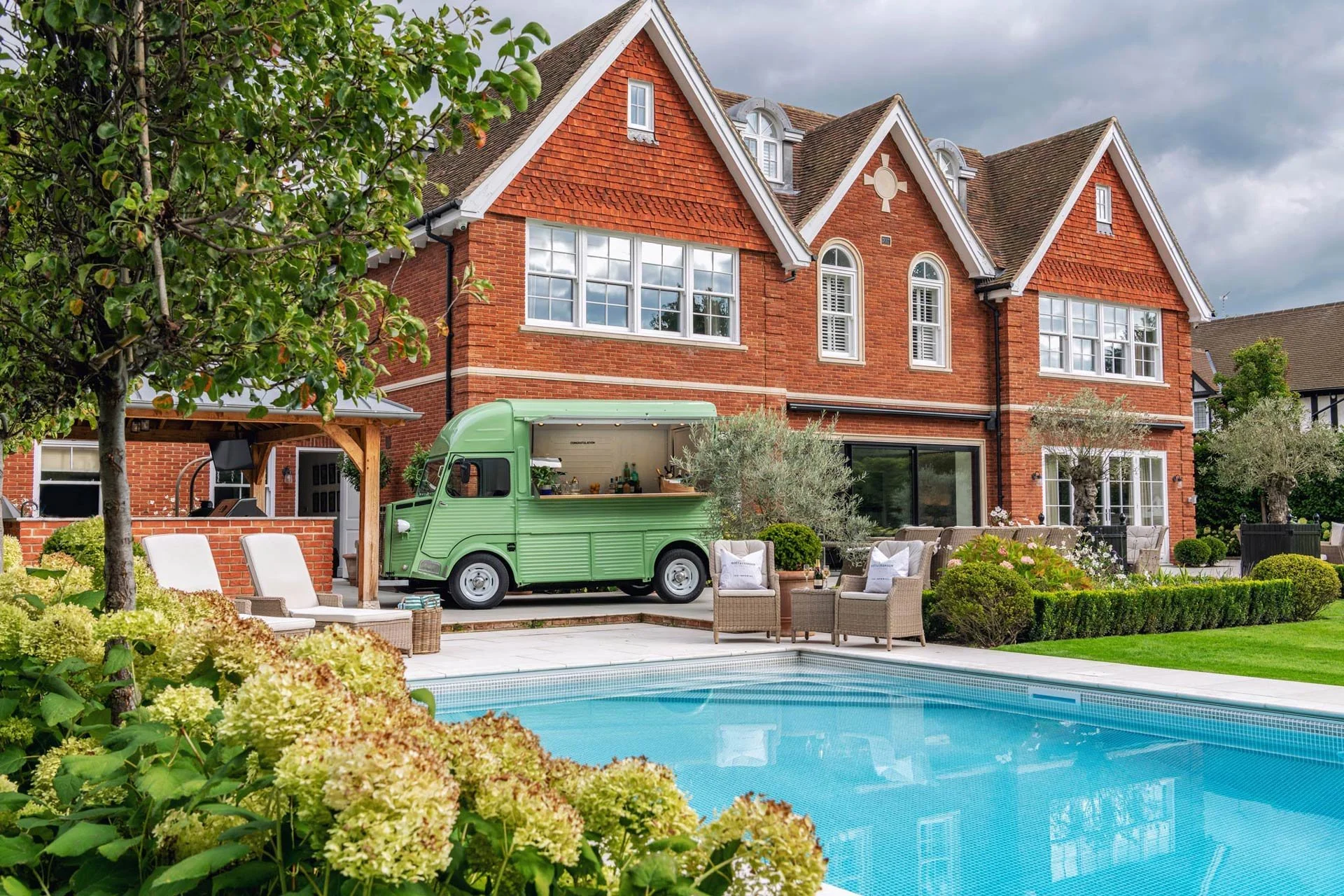 Luxury Brick Red House with Pool and Vintage Food Truck Van