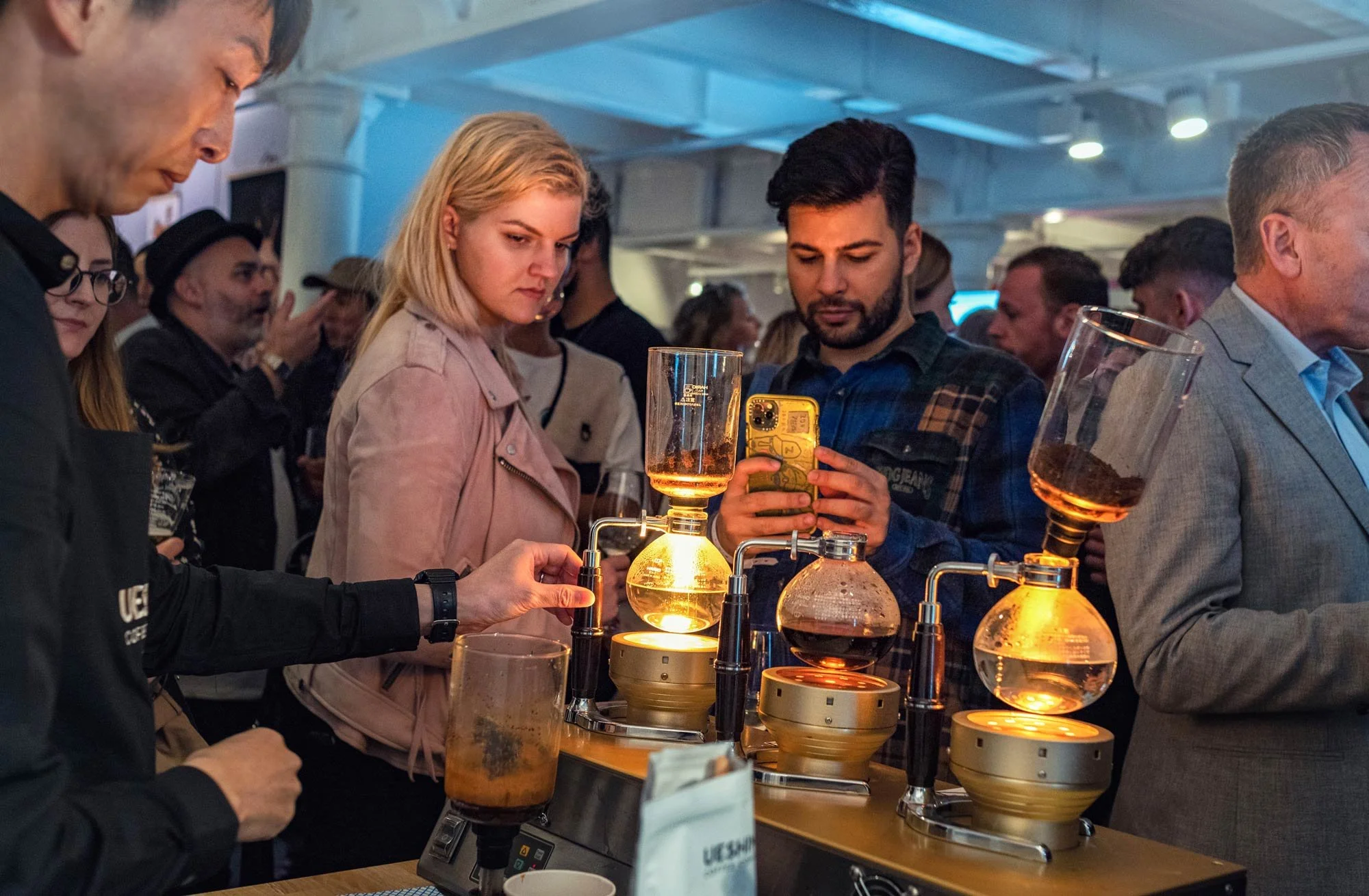 Busy coffee station brand activation event photography London