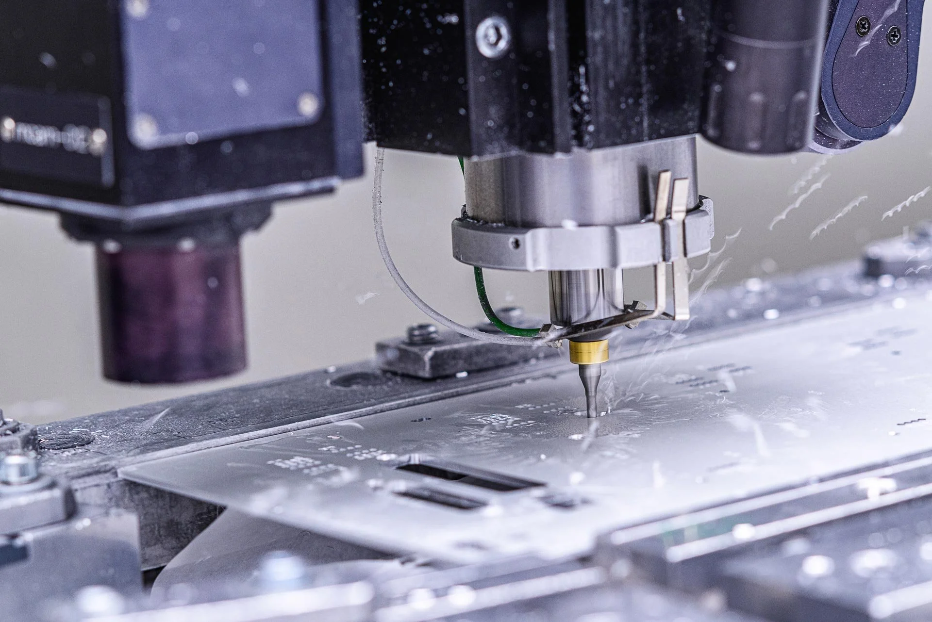Close-up of CNC machine precision cutting aluminium in a manufacturing facility – industrial photographer London