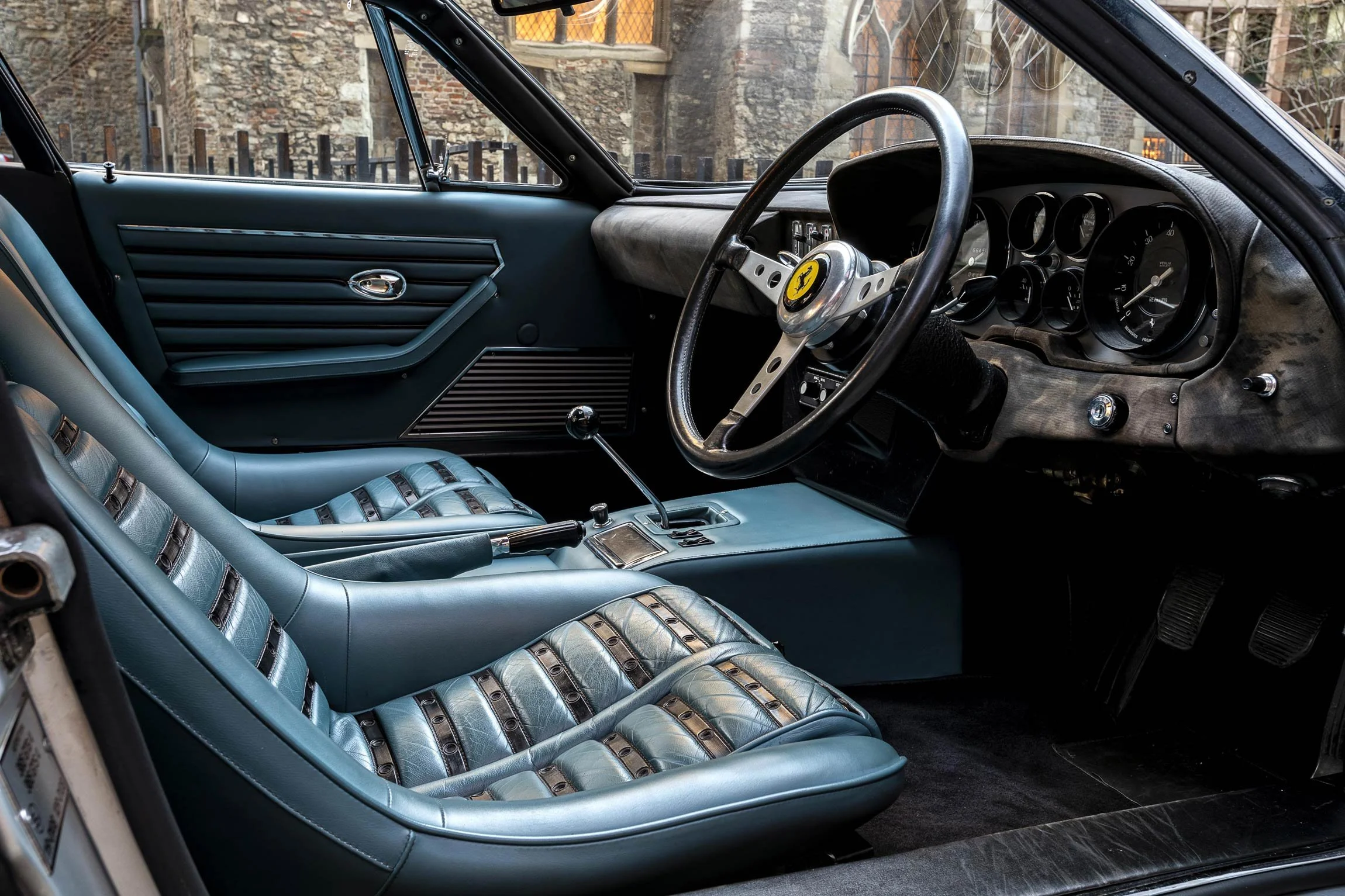 Classic Ferrari Daytona interior front seats in blue leather photographed in London by classic car photographer Dean Wright