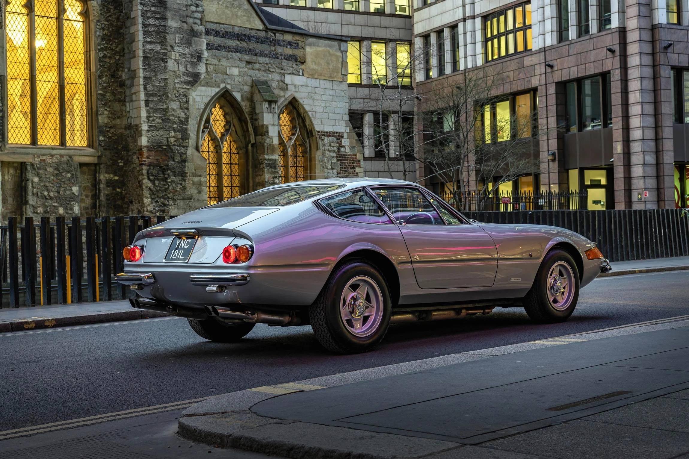 Classic Ferrari Daytona rear three-quarter night shot in the City of London with atmospheric purple lighting by classic car photographer Dean Wright