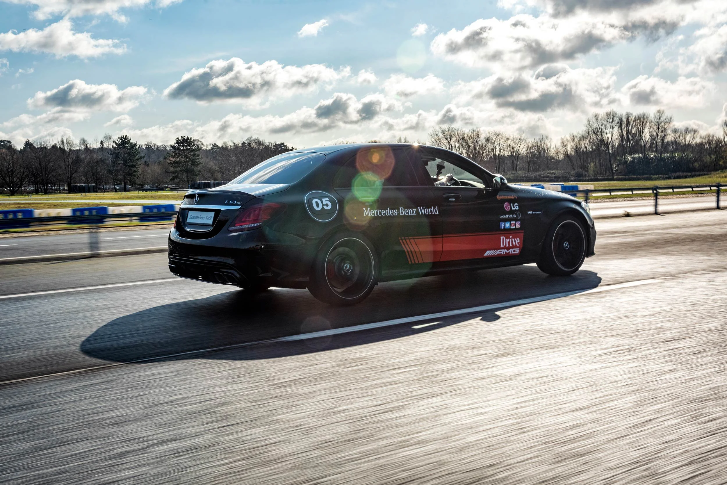 Tracking shot of a Mercedes-AMG C63 at Mercedes-Benz World — automotive event photography London