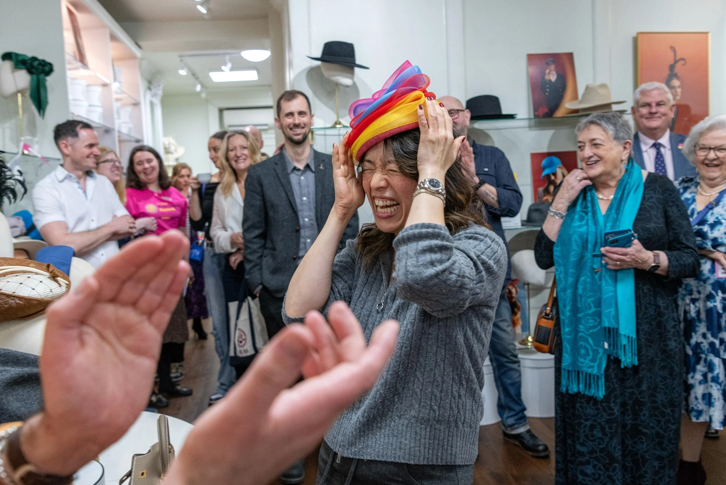 Candid event photography at the Brain Tumour Research Wear A Hat Day launch at Lock & Co. Hatters in London.