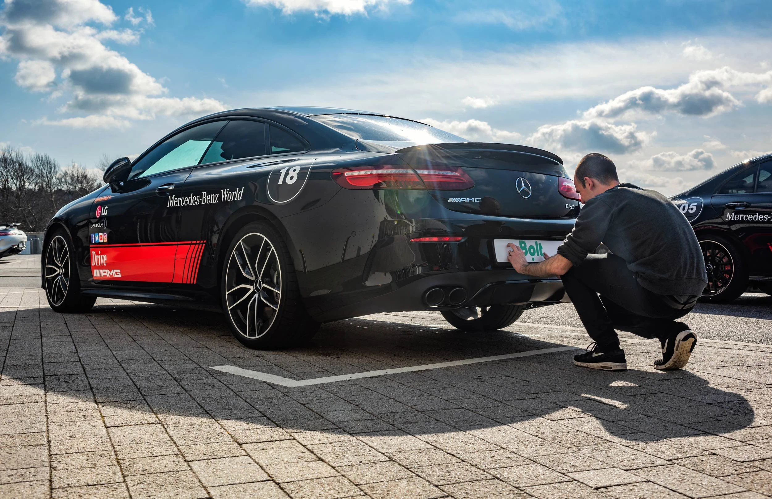 Bolt plate being fitted to a Mercedes-AMG E53 at Mercedes-Benz World — brand event photography London