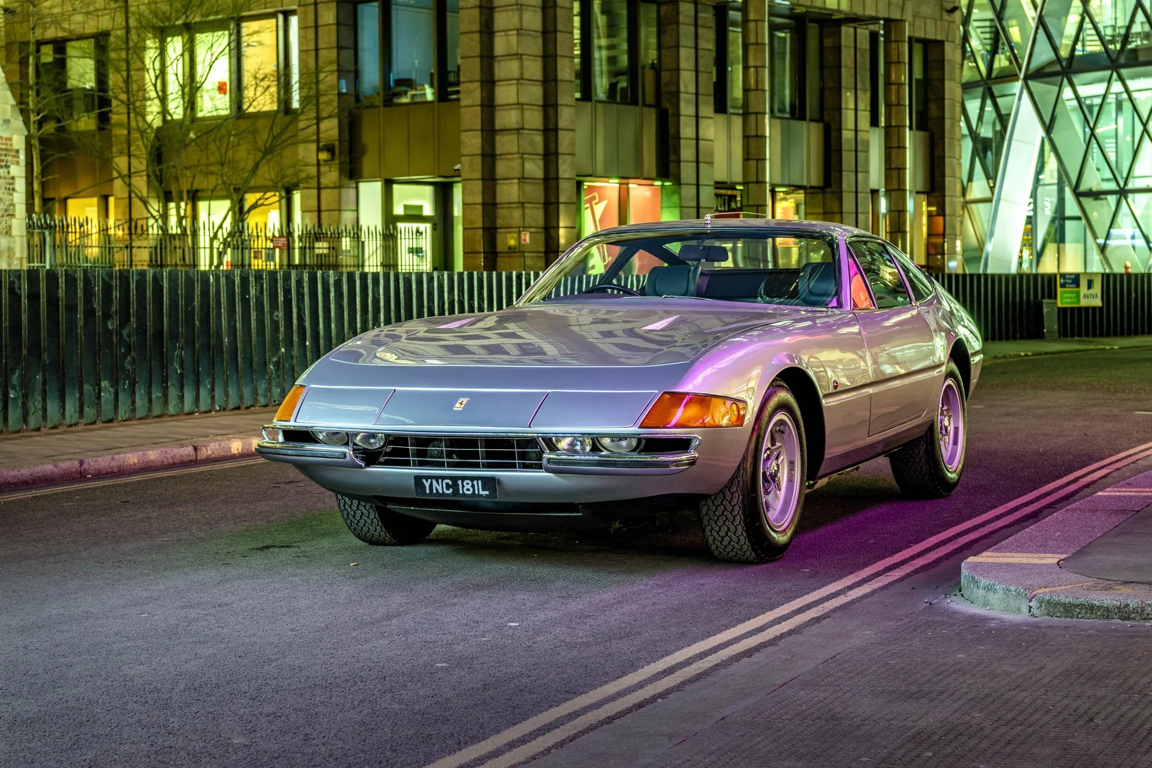 Classic Ferrari Daytona front three-quarter evening shot in the City of London with atmospheric purple lighting by classic car photographer Dean Wright
