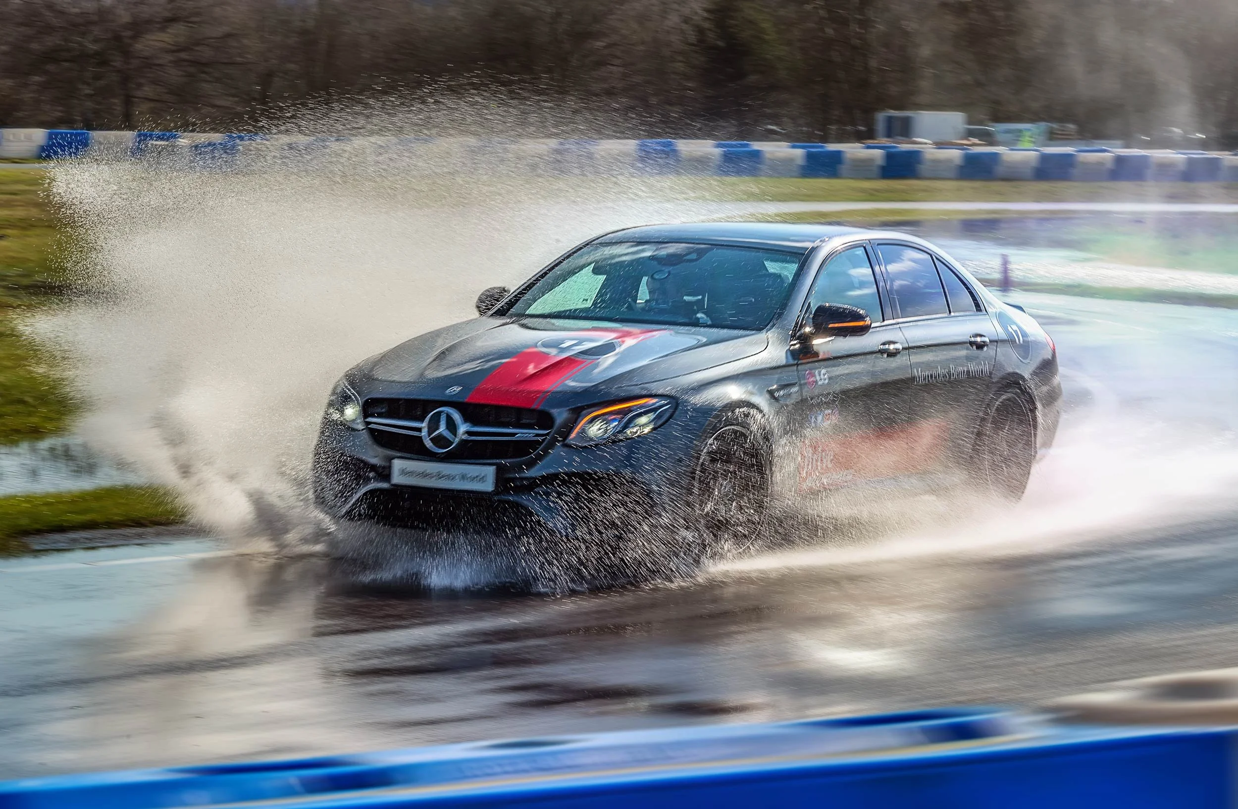 Mercedes-AMG E-Class on the wet handling circuit at Mercedes-Benz World during a Bolt driver event, photographed by a corporate event photographer in London