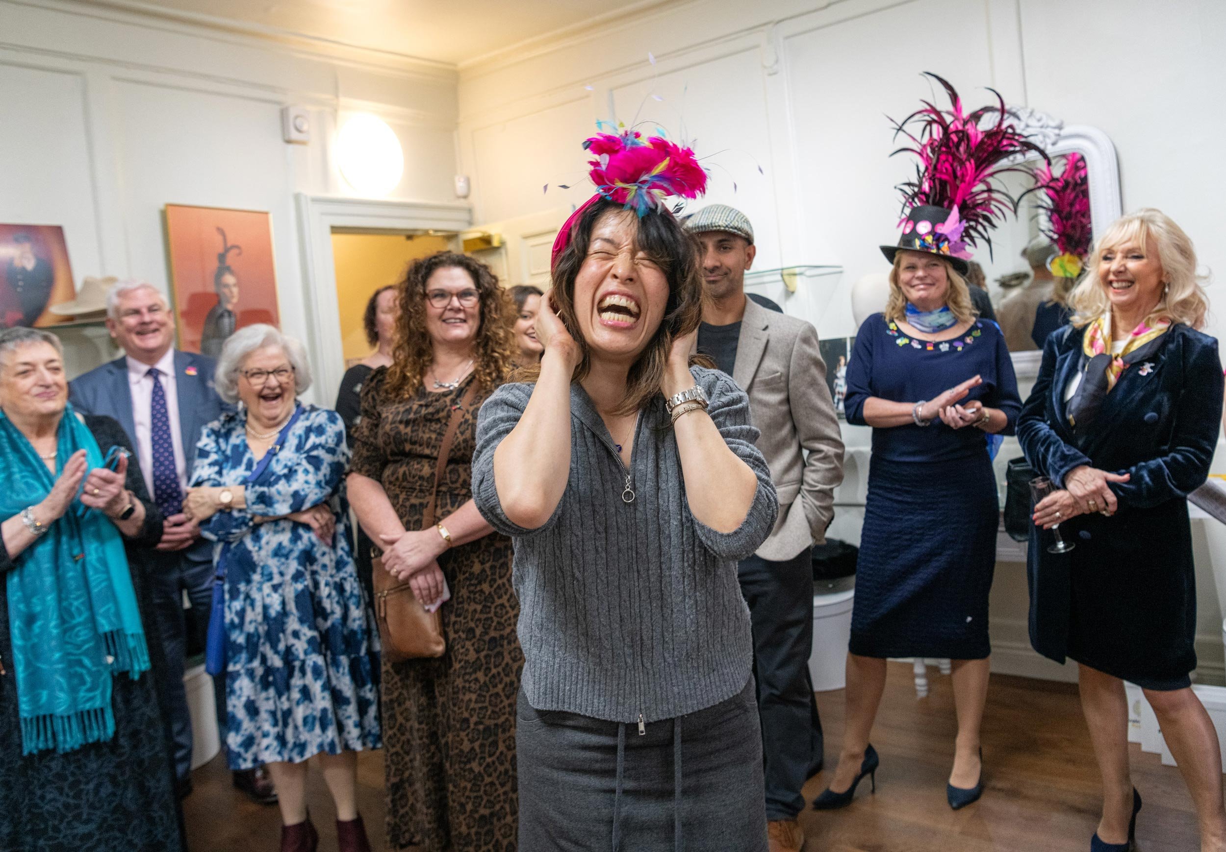 Candid photography from the Brain Tumour Research Wear A Hat Day event at Lock & Co. Hatters in London.