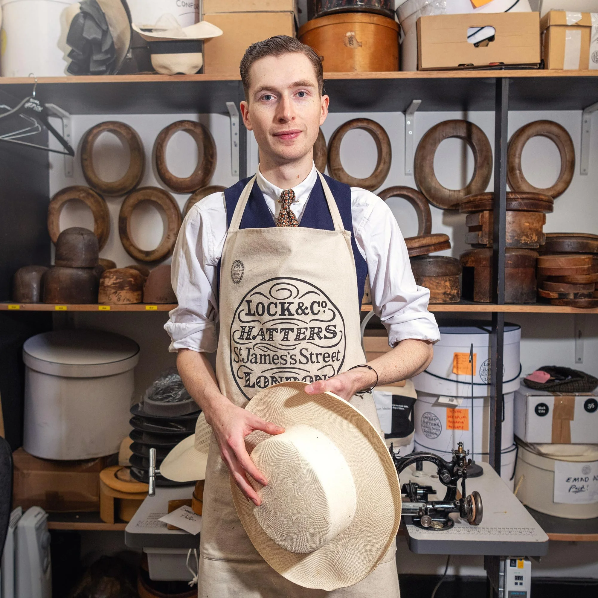 Environmental portrait of a Lock & Co. Hatters craftsman in the workshop at St James’s, London.