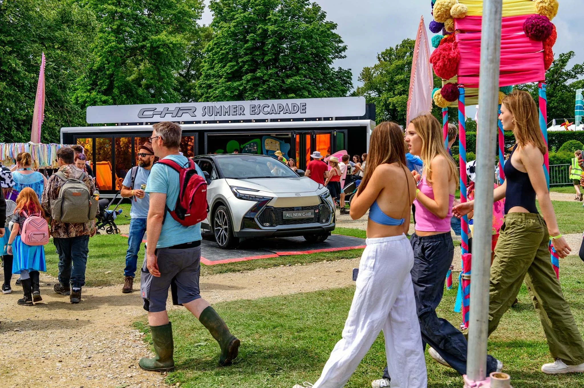 Toyota C-HR on display at Pub in the Park music festival brand activation with visitors walking past – automotive events photography London