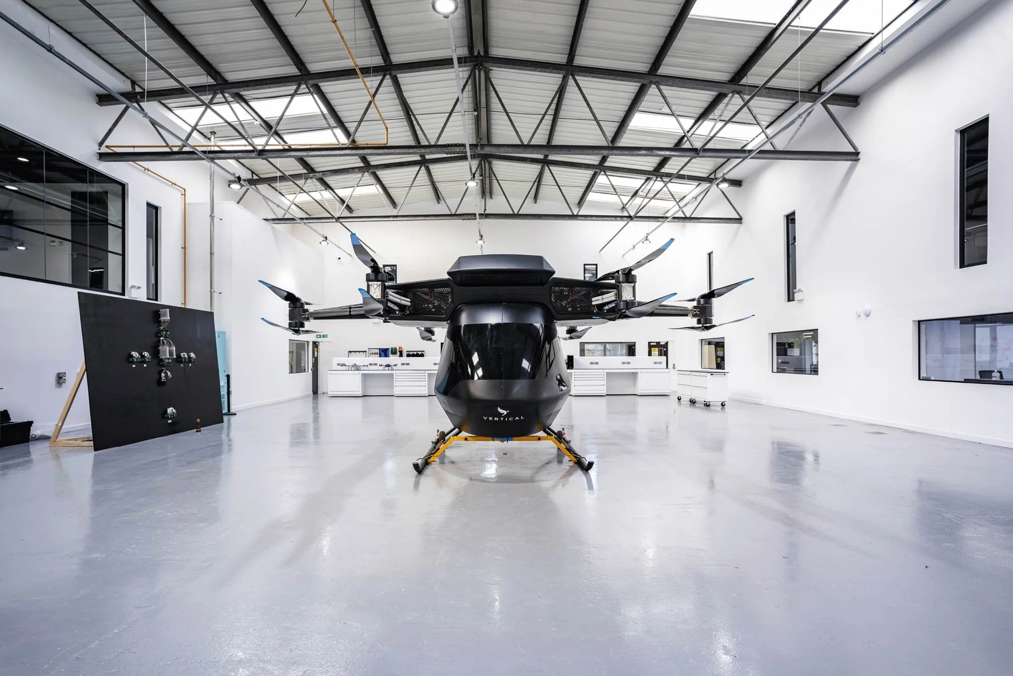 Aerospace photography in a modern, clean industrial facility featuring a Vertical eVTOL aircraft. Dean Wright commercial and industrial photographer London.