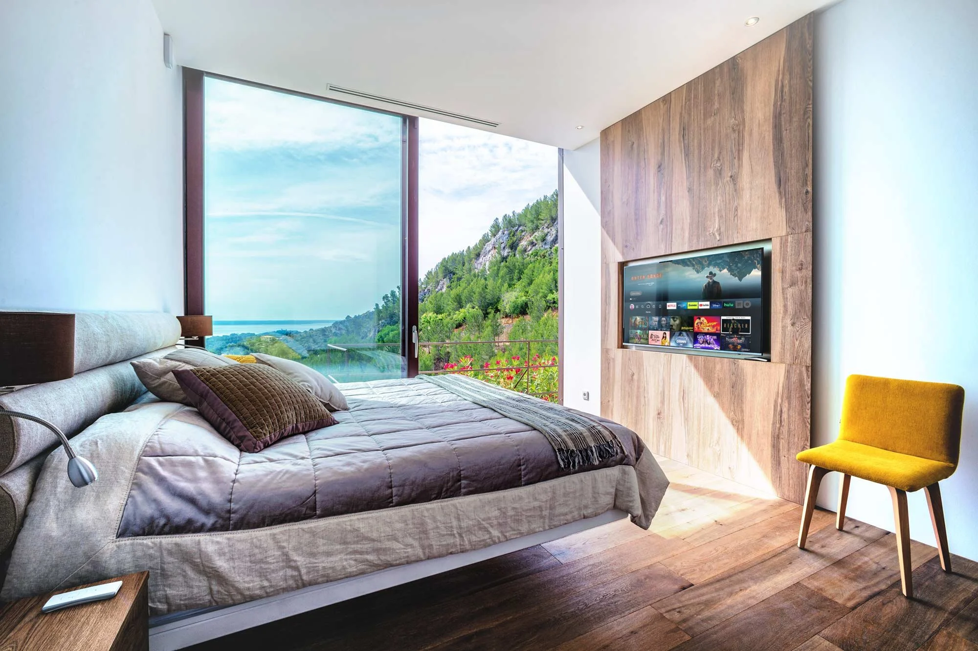 Luxury Bedroom with Floating Wood Panelling and Mountain View