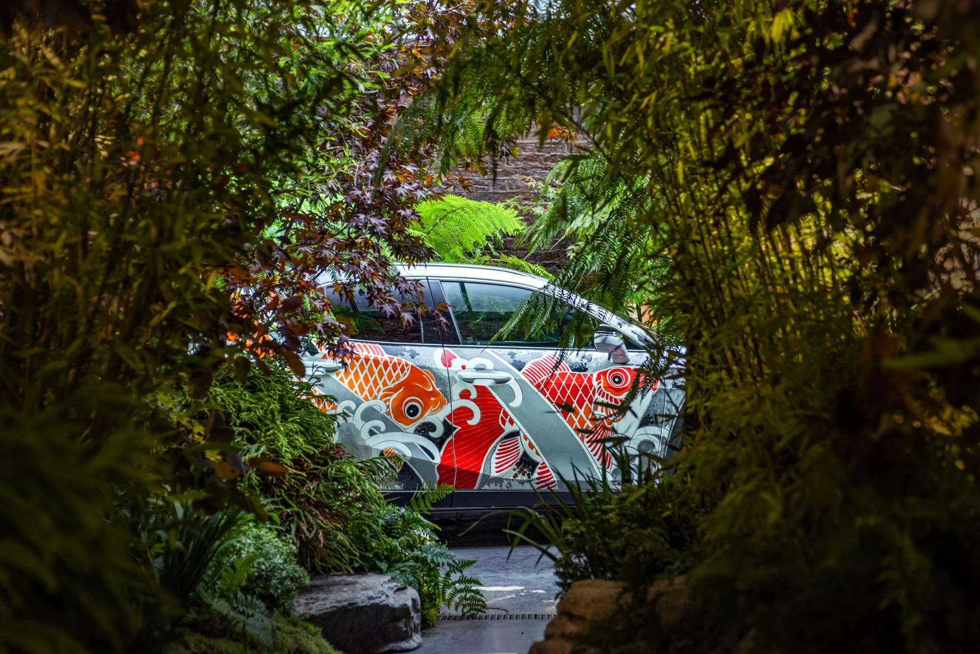 Tattooed Lexus UX side view brand activation photography London