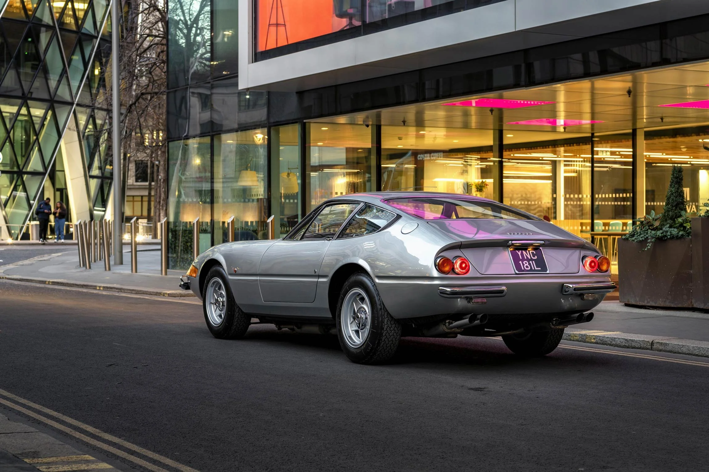 Classic Ferrari Daytona rear three-quarter night shot in the City of London with atmospheric purple lighting by classic car photographer Dean Wright