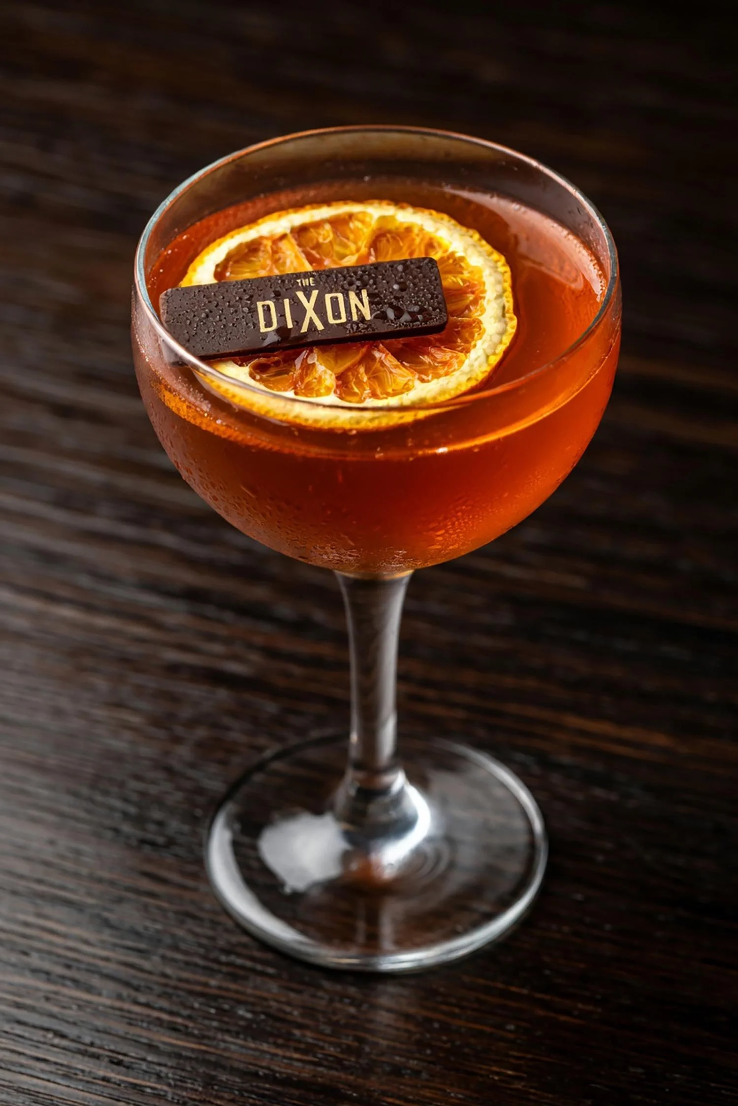 Signature Cocktail with Orange Slice at Courtroom Bar, The Dixon Hotel London