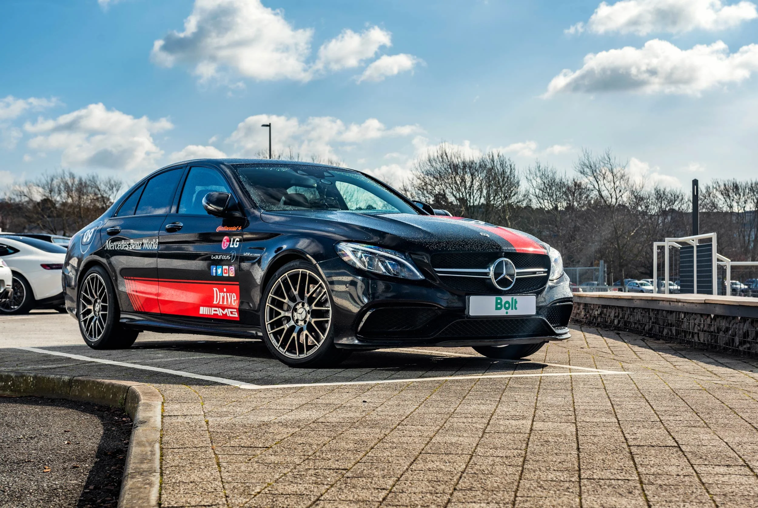 Mercedes-AMG C-Class with a Bolt plate at Mercedes-Benz World, Brooklands