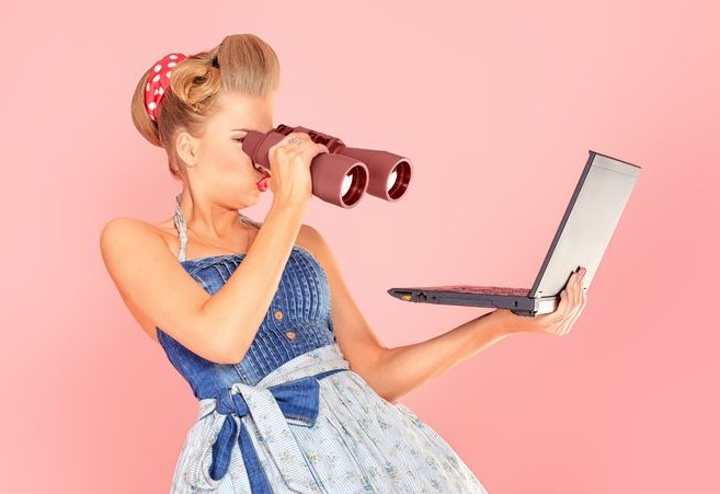 woman-looking-at-computer-through-a-pair-of-binoculars-e1425067414344.jpg