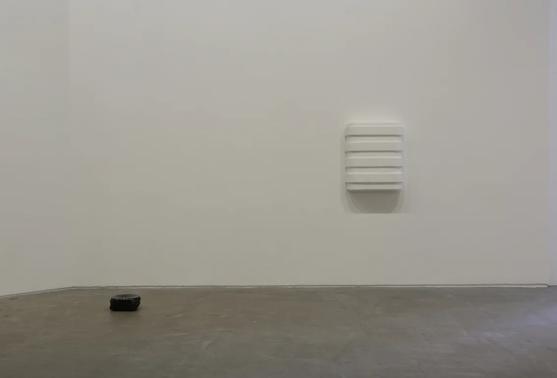 (left to right) the time between , 2016. Polished coal Untitled , 2016. Plaster